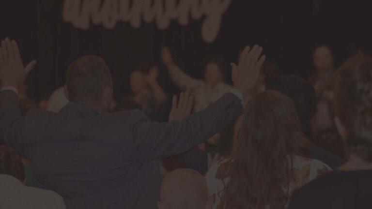 people worshiping God with their hands up